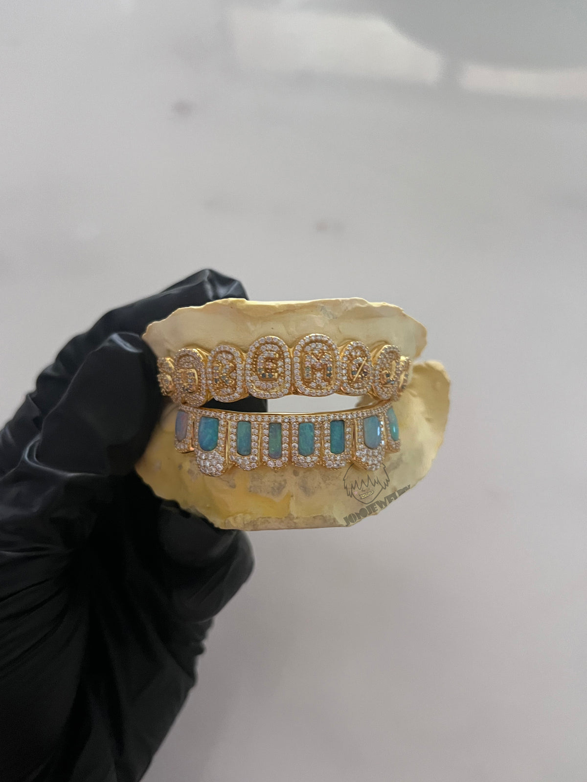 Custom Iced Out Gold Grillz with Opal Inlay